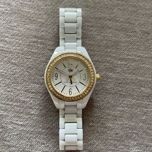 Juicy Couture White and Gold Stainless Steel Water Resistant Watch.
